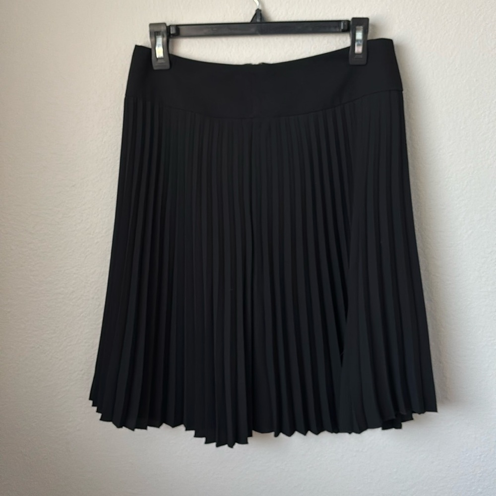 Pleated black skirt.
